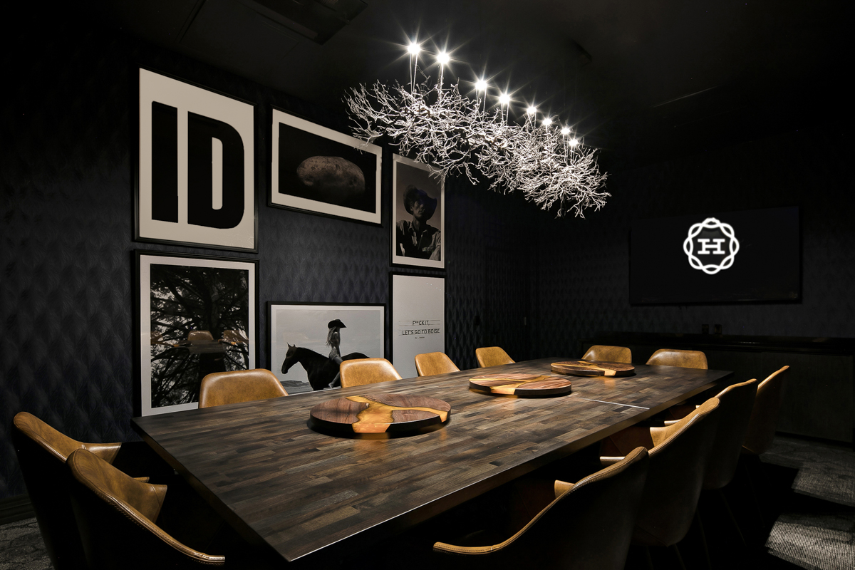 Hemlock Boise private dining room with dark walls and branch chandelier